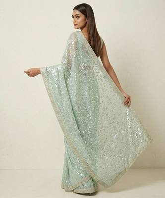 Green embroidered georgette saree with unstitched blouse 4