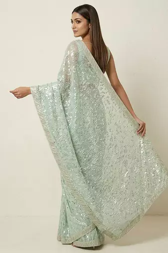 Green embroidered georgette saree with unstitched blouse