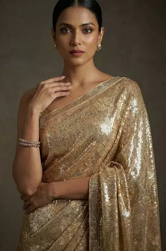 Gold embroidered shimmer georgette saree with unstitched blouse