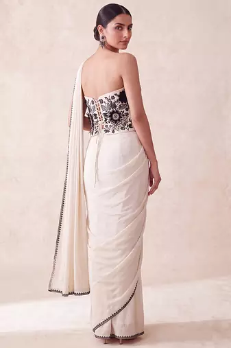 Cream embroidered lycra corset blouse and saree