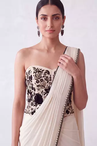Cream embroidered lycra corset blouse and saree