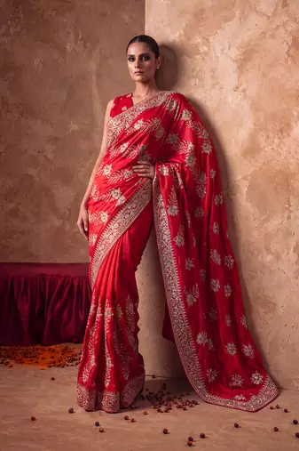 Red embroidered silk saree with unstitched blouse