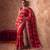 Red embroidered silk saree with unstitched blouse