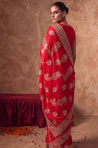 Red embroidered silk saree with unstitched blouse