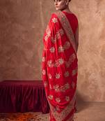 Red embroidered silk saree with unstitched blouse
