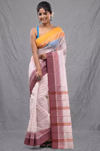 white cotton blend taant saree with woven designs