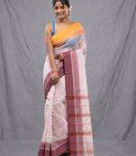 white cotton blend taant saree with woven designs
