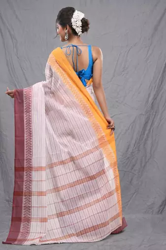 white cotton blend taant saree with woven designs