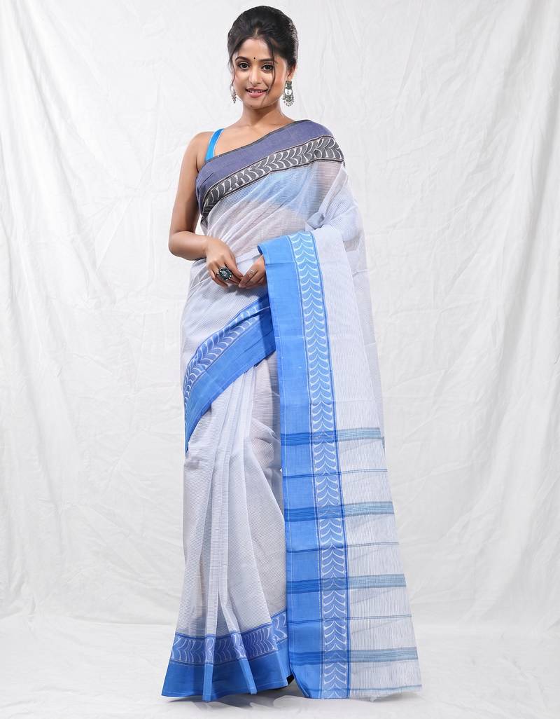 white cotton blend taant saree with woven designs