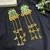 Kashmiri Fusion earrings- Long green Indian drop earrings with gold-tone detailing and multiple dangling chains