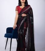 Women's black chevron print georgette saree with unstitched piece