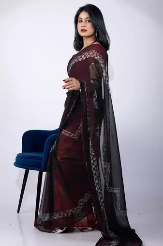 Women's black chevron print georgette saree with unstitched piece