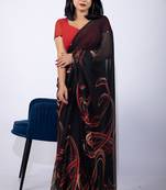 Women's black geometric print georgette saree with unstitched piece