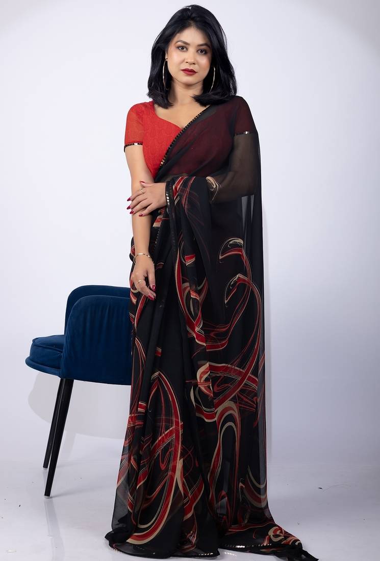 Women's black geometric print georgette saree with unstitched piece