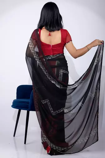 Women's black chevron print georgette saree with unstitched piece