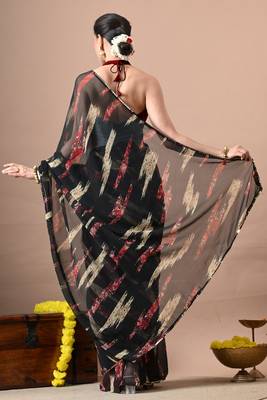 Women's black abstract print georgette saree with unstitched piece 3