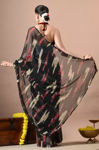 Women's black abstract print georgette saree with unstitched piece