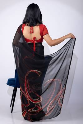 Women's black geometric print georgette saree with unstitched piece 4