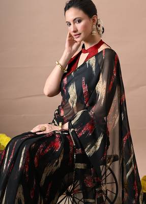 Women's black abstract print georgette saree with unstitched piece 5