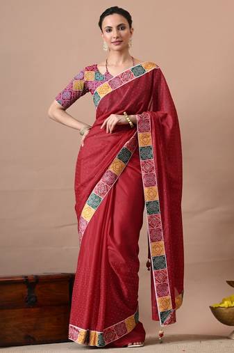 Women's red embellished georgette saree with unstitched piece