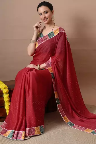 Women's red embellished georgette saree with unstitched piece