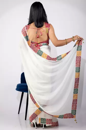 Women's white embellished georgette saree with unstitched piece