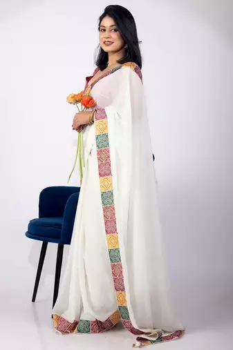 Women's white embellished georgette saree with unstitched piece