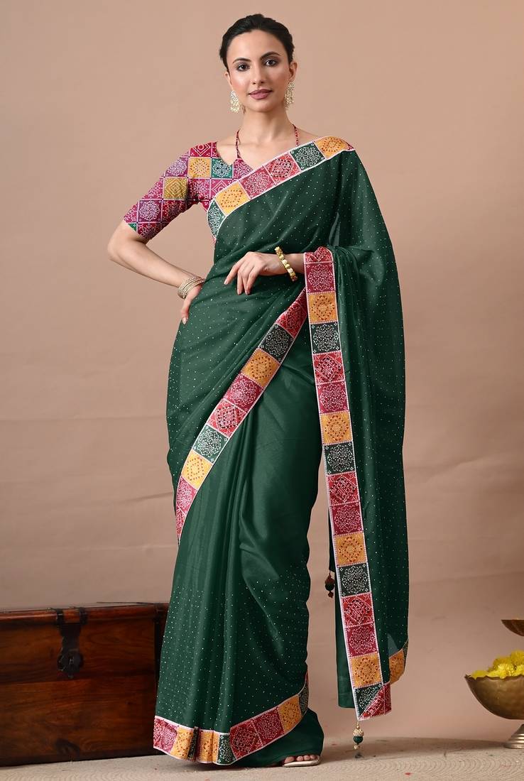 Women's green embellished georgette saree with unstitched piece