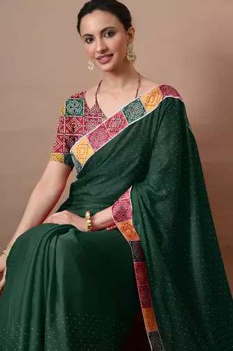 Women's green embellished georgette saree with unstitched piece