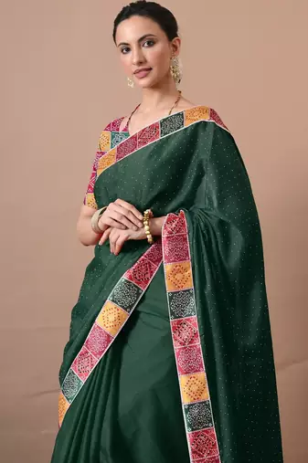Women's green embellished georgette saree with unstitched piece