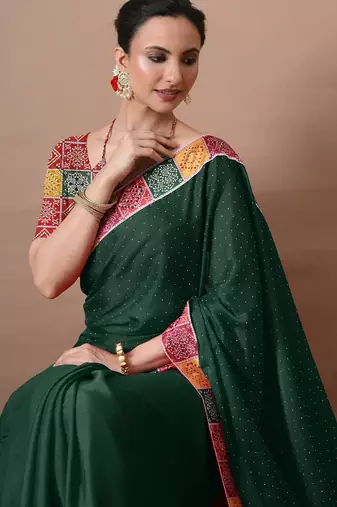 Women's green embellished georgette saree with unstitched piece