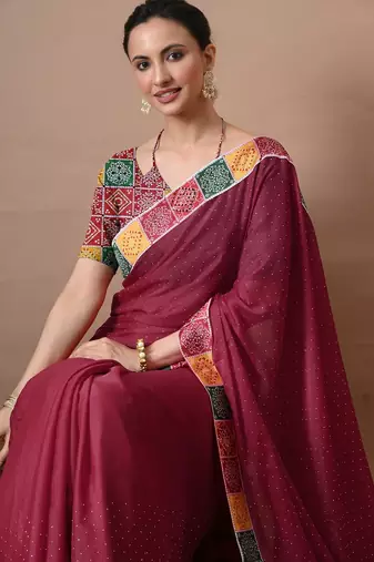 Women's maroon embellished georgette saree with unstitched piece