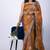 Women's orange embellished soft silk blend saree with unstitched piece