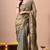 Women's green embellished soft silk blend saree with unstitched piece