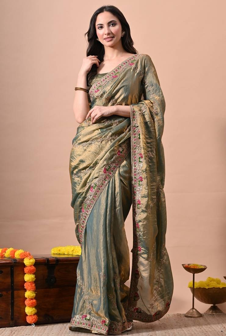 Women's green embellished soft silk blend saree with unstitched piece