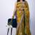 Women's mustard embellished soft silk blend saree with unstitched piece