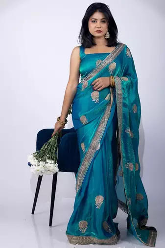 Women's turquoise embellished soft silk blend saree with unstitched piece