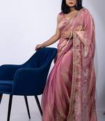 Women's pink embellished soft silk blend saree with unstitched piece
