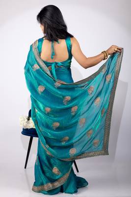 Women's turquoise embellished soft silk blend saree with unstitched piece 2