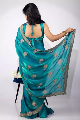 Women's turquoise embellished soft silk blend saree with unstitched piece