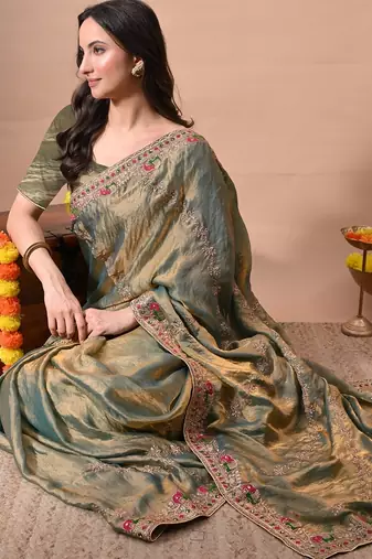 Women's green embellished soft silk blend saree with unstitched piece