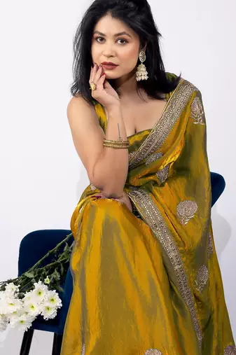 Women's mustard embellished soft silk blend saree with unstitched piece