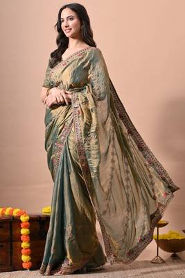 Women's green embellished soft silk blend saree with unstitched piece 3