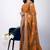 Women's orange embellished soft silk blend saree with unstitched piece