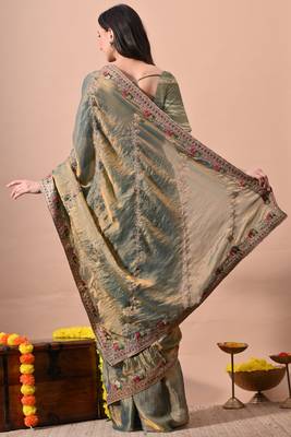 Women's green embellished soft silk blend saree with unstitched piece 4