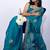 Women's turquoise embellished soft silk blend saree with unstitched piece