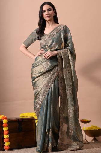 Women's turquoise embellished soft silk blend saree with unstitched piece