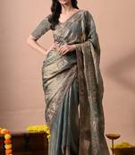 Women's turquoise embellished soft silk blend saree with unstitched piece