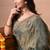 Women's green embellished soft silk blend saree with unstitched piece