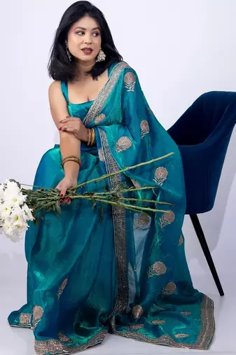 Women's turquoise embellished soft silk blend saree with unstitched piece